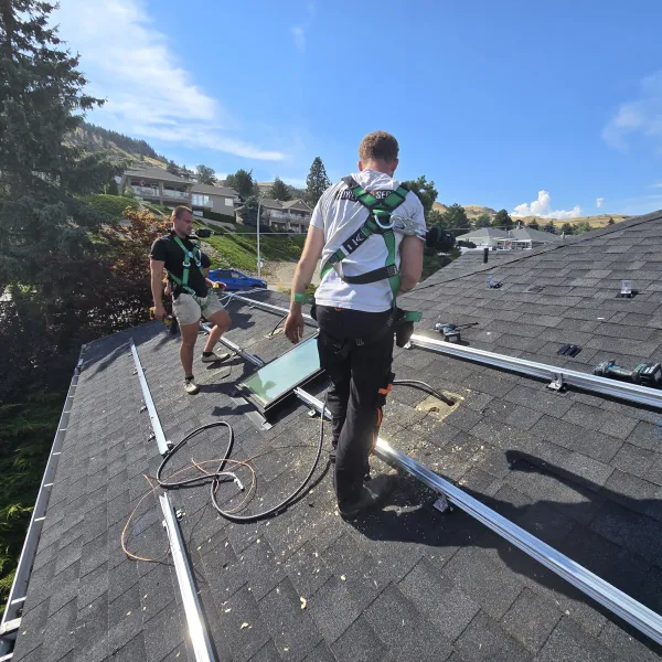 An installer walking along freshly mounted rails